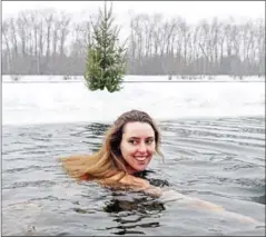  ?? AFP ?? Osman Delibash, the club’s star swimmer, recently made a video showing her sitting for an hour in the frozen-over pond in her garden, a record for the longest stint in cold water by a woman.