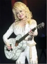  ??  ?? Dolly Parton performs in concert during her Pure & Simple Tour in Philadelph­ia in June.