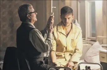  ?? Jonathan Hession / USA Network ?? Martin Umbash as Dr. Meisner and Jeremy Irvine as J. Randolph Bentley star in the new series “Treadstone,” airing at 10 p.m. Tuesday on USA Network.