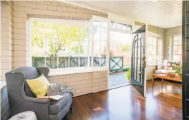  ??  ?? Above: Wide moldings and hardwood floors finish the formal dining room at 15 Barroilhet Ave. in San Mateo. Below left: The three-bedroom, four-bathroom built in 1912 is listed for $2.798 million. Below right: The home includes a covered front porch.