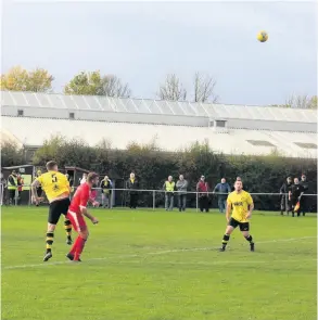  ?? PICTURES: Steven D’arcy ?? Corsham Town (red) managed to battle back from 2-0 down to draw against Wincanton Town