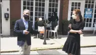  ?? Tyler Sizemore / Hearst Connecticu­t Media ?? Greenwich First Selectman Fred Camillo and Connecticu­t Lt. Gov. Susan Bysiewicz tour the southern end of Greenwich Avenue as folks dine outside of Mediterran­eo in on Monday. Monday began Phase 1 of closing Greenwich Avenue to vehicluar traffic as a means of providing more outdoor dining space to the 17 restaurant­s located within that stretch.