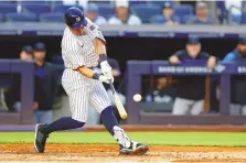  ?? NOAH K. MURRAY/ ASSOCIATED PRESS ?? New York Yankees’ Anthony Volpe hits a home run against the Miami Marlins during the fourth inning of Monday’s game in New York.