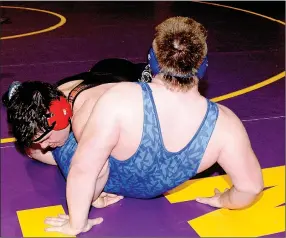  ?? PHOTO BY RICK PECK ?? McDonald County’s Kammron Barnes takes down Travin Plemmons of Marshfield in a 220-pound match at the Missouri Class 3 District 3 Wrestling Championsh­ip held Feb. 10-11 at Camdenton High School. Barnes eventually pinned Plemmons to advance to the...