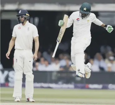  ??  ?? 0 Pakistan’s Haris Sohail jumps in the air after hitting the winning runs as Alastair Cook looks on.