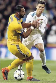  ?? AP ?? Real Madrid’s Cristiano Ronaldo (right) is blocked by Juventus’ Medhi Benatia during a Champions League quarter-final second leg match between Real Madrid and Juventus at the Santiago Bernabeu stadium in Madrid, yesterday. Juventus won 3-1.