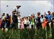  ?? ASSOCIATED PRESS ?? TIGER WOODS WALKS past spectators on his way to the eighth tee during the second round of the PGA Championsh­ip golf tournament Friday at Bellerive Country Club in St. Louis.