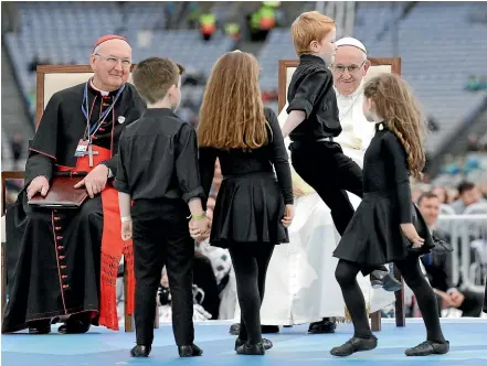  ?? AP ?? Pope Francis watches dancing children as he attends the Festival of Families in Croke Park Stadium in Dublin.