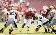  ?? Ezra Shaw / Getty Images ?? Barry Sanders and the Stanford ground game get going in the second half of a 35-0 romp over Army.