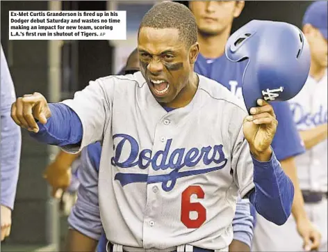  ?? AP ?? Ex-Met Curtis Granderson is fired up in his Dodger debut Saturday and wastes no time making an impact for new team, scoring L.A.’s first run in shutout of Tigers.