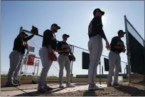  ?? ROSS D. FRANKLIN — THE ASSOCIATED PRESS ROSS D. FRANKLIN — THE ASSOCIATED PRESS ?? Indians pitcher Kyle Dowdy, front, fields a grounder as pitchers Carlos Carrasco, left, Shane Bieber, middle, and Logan Allen, right, look on during workouts for pitchers and catchers Feb. 13.
From left, Dominic Leone, Logan Allen, Kyle Dowdy, Shane Bieber and Carlos Carrasco wait their turn during a pitching session.