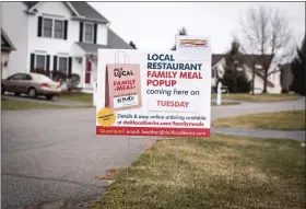  ??  ?? Yard signs made by Kevin Bezler of MADJ Marketing are popping up this week to advertise the Do It Local Berks family meal pop-ups.