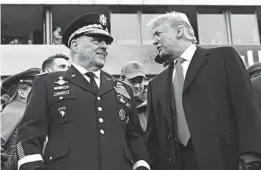  ?? SUSAN WALSH/AP ?? Army Gen. Mark Milley chats with President Trump at Saturday’s Army-Navy football game in Philadelph­ia. Trump earlier chose Milley as chairman of the Joint Chiefs of Staff.