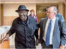  ?? FRED ZWICKY/JOURNAL STAR FILE ?? Cleve Heidelberg enters the Peoria County Courthouse on May 25, 2017, for the first time in 47 years from the street entrance free on bond as he heads into a hearing. Walking with Heidelberg is defense attorney Andy Hale.