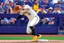  ?? MATT YORK/ASSOCIATED PRESS FILE PHOTO ?? Milwaukee Brewers first baseman Rhys Hoskins fields a throw March 18 during the first inning of a spring training game against the Los Angeles Angels in Phoenix.