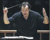  ?? STEVEN SENNE — AP PHOTO ?? Boston Symphony Orchestra music director Andris Nelsons rehearses with the orchestra at Symphony Hall, in Boston, Nov. 20, 2014.