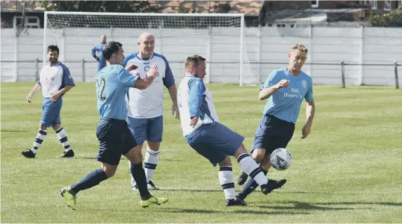  ??  ?? Action from The Times Inn O40s (white/blue) v Ferryhill Greyhound O40s (light blue) at the Billy Hardy Centre on Saturday.