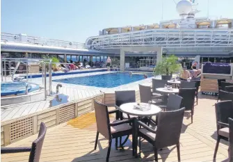  ?? SANDRA AND JOHN NOWLAN PHOTOS ?? Tables ready for lunch by the pool on Eurodam in the sun.