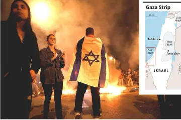  ??  ?? Residents of southern Israel protest against their government’s decision to hold fire in Gaza in response to a similar decision by Palestinia­n militants, in Sderot, Israel. — Reuters photo