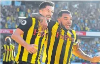  ?? Getty. ?? Watford scorers Craig Cathcart, left, and Troy Deeney celebrate the second goal.