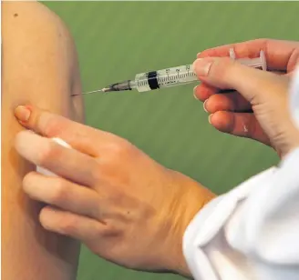  ?? REUTERS ?? A nurse in Sao Paulo, Brazil, receives a dose of the Sinovac COVID-19 vaccine Sunday after Brazil’s health regulator approved its emergency use.