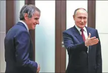  ?? KREMLIN PRESS OFFICE / GETTY IMAGES ?? Russian President Vladimir Putin (right) meets Internatio­nal Atomic Energy Agency Director-General Rafael Grossi in Sochi, Russia, on Wednesday.