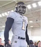  ?? TENNESSEAN ?? The Vanderbilt football team unveiled a new Nike alternate uniform and helmet during its annual Dore Jam fan event in 2015. SHELLEY MAYS / THE