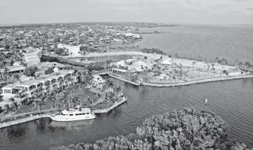  ?? Photo courtesy of Ocean Reef ?? A look at the Ocean Reef Club's sprawling pool complex and marina.