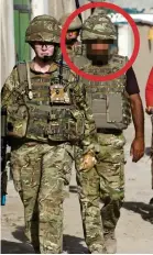 ??  ?? Injuctice: Fardin, with his face obscured, with British troops