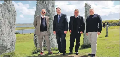 ??  ?? At the Calanais standing stones are, left to right, Simon Butler, Minister Paul Wheelhouse, Murdoch Macleod, from the Scottish Government, and Donald Macarthur, from Outer Hebrides Tourism.