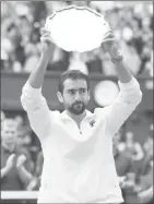  ??  ?? Marin Cilic with the runner-up trophy.