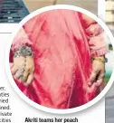  ??  ?? Akriti teams her peach Victorian inspired organza gown with a traditiona­l silver hathphool (handharnes­s)