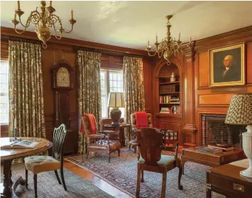  ??  ?? RIGHT The lovely old wood paneling in the family library was once in the banquet room of Sparhawk Hall, a great Georgian house built in 1742 in Kittery, Maine.