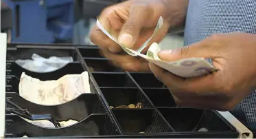  ?? African News Agency (ANA) ?? ABSA and First National Bank say there was a decline in cash withdrawal­s from ATMs and till points during the hard lockdown, but these withdrawal­s are now returning to normal. |