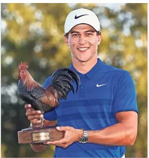  ??  ?? All smiles: Cameron Champ posing with the trophy after winning the Sanderson Farms Championsh­ip at the Country Club of Jackson on Sunday. — AFP