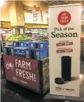  ?? CANDICE CHOI THE ASSOCIATED PRESS ?? Amazon’s Echo and Echo Dot appear on sale Monday at a Whole Foods Market in New York. Amazon has completed its $13.7 billion takeover of organic grocer Whole Foods, and the e-commerce giant is wasting no time putting its stamp on the company.