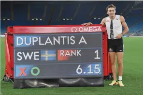  ?? (AFP) ?? Duplantis poses near the time board after winning in the men’s Pole Vault at the IAAF Diamond League at the Olympic stadium in Rome on Thursday.