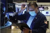  ?? RICHARD DREW — THE ASSOCIATED PRESS ?? Trader John Santiago works on the floor of the New York Stock Exchange on Tuesday.