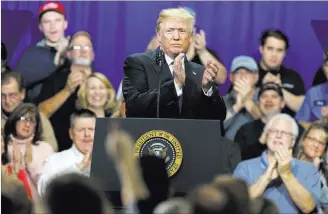  ?? Evan Vucci ?? The Associated Press President Donald Trump promotes his tax policy Monday during a rally at Sheffer Corporatio­n in Blue Ash, Ohio. The Dow’s dive did not merit a mention on the president’s Twitter feed.