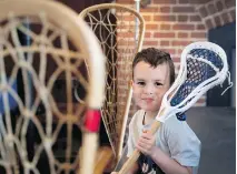  ?? ALLEN McINNIS ?? Young Kahrhatake­hshon Delormier, 4, a descendant of famous lacrosse player Big John Canadian, was on hand for the Canadian Lacrosse Foundation news conference in Montreal on Tuesday.