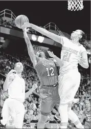  ?? AMY SMOTHERMAN BURGESS/KNOXVILLE NEWS SENTINEL FILES ?? Tennessee center Mercedes Russell (right) blocks a shot in the 2014 NCAA tournament. After having surgery on both feet, Russell is ready to play this week on the Lady Vols’ trip to Italy.