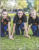  ?? PHOTO: DUBBO PHOTO NEWS ?? Brooke Galley, Maya Piras and Millie Gooch with the “I Love Dubbo” T-shirts they’ll be proudly wearing during the athletics tour to Canada.