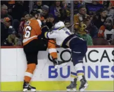  ?? THE ASSOCIATED PRESS FILE ?? Flyers defenseman Christian Folin, here kind of kicking away a check attempt by former Flyer and current Blues forward Brayden Schenn on Jan. 7, played and played well against Winnipeg Monday on a full stomach.