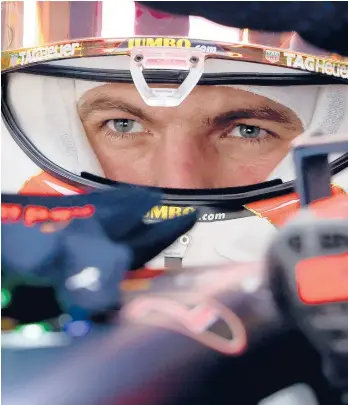  ?? GIUSEPPE CACACE/GETTY ?? Red Bull’s Dutch driver Max Verstappen sits in his car in the pits of the Yas Marina Circuit on Friday.