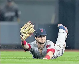  ?? BOSTON HERALD FILE ?? Red Sox outfielder Andrew Benintendi, seen making a diving catch during Game 4 of the 2018 ALCS, is the last of the team’s World Series winning outfielder­s.