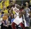  ?? MARCIO JOSE SANCHEZ — AP ?? Jeff Green is defended by Warriors forward Draymond Green during the first half of Game 2 of the NBA Finals on June 3 in Oakland, Calif.