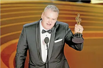  ??  ?? John Ottman accepts the Film Editing award for ‘Bohemian Rhapsody’ onstage during the 91st Annual Academy Awards at Dolby Theatre on Feb 24 in Hollywood, California. — AFP photo