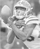  ?? MARK WALLHEISER/AP ?? Florida wide receiver Tyrie Cleveland has a pass broken up during the Gators’ win over the Seminoles on Saturday in Doak Campbell Stadium.