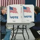  ?? TIMOTHY A. CLARY/GETTY-AFP ?? New Hampshire residents cast their ballots in the state’s primary Tuesday in Concord.