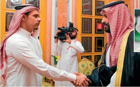  ??  ?? Salah Khashoggi, left, a son of Jamal Khashoggi, shakes hands with Saudi Crown Prince Mohammed bin Salman in Riyadh on October 23, 2018. The family of the slain columnist announced late on Friday that they have forgiven his Saudi killers, giving automatic legal reprieve to the five government agents convicted of his murder and who had been sentenced to execution.